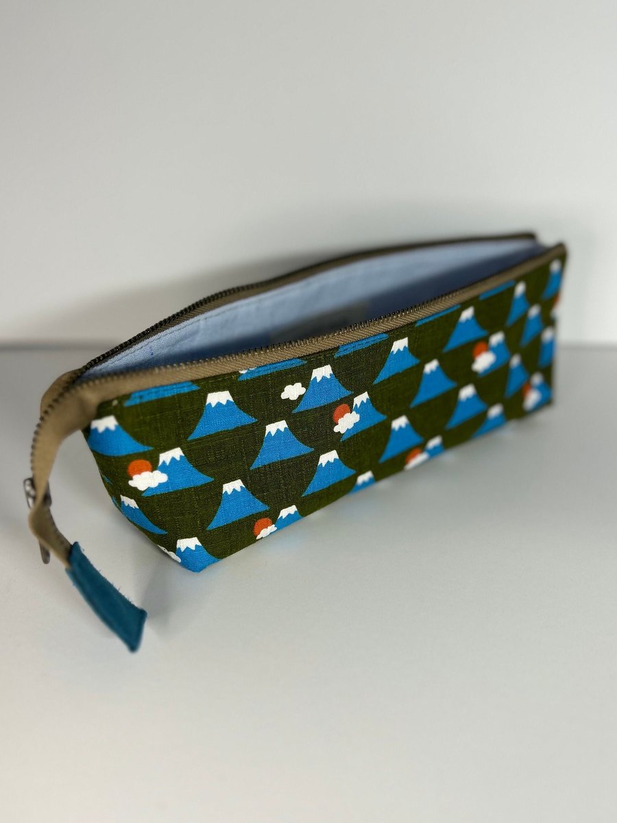 Climb Every Volcano Triangle Zip Bag